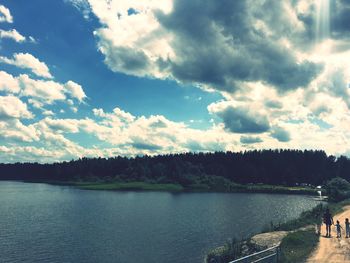 Scenic view of lake against cloudy sky