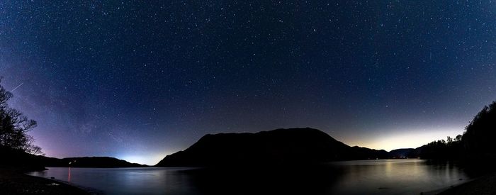 Scenic view of sea against sky at night