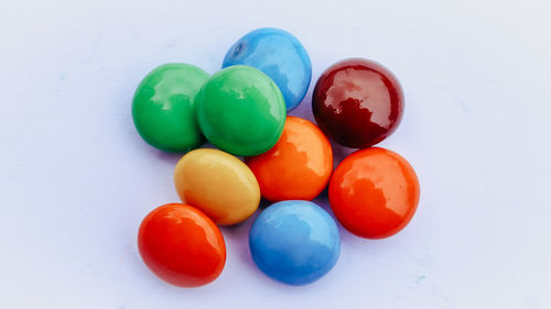 High angle view of candies against white background