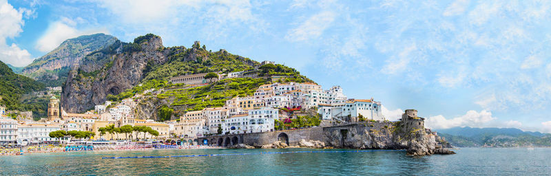 Panoramic view, aerial skyline of small haven of amalfi village with tiny beach, campania, italy