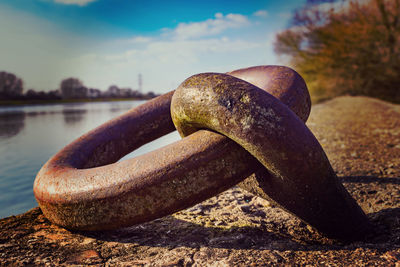 Close-up of rusty metal on rock