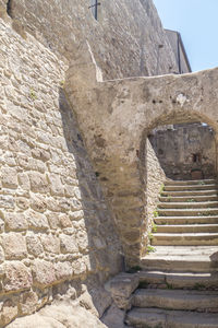 Low angle view of stone wall