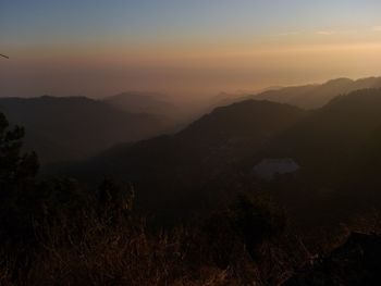 Scenic view of mountains against sky during sunset