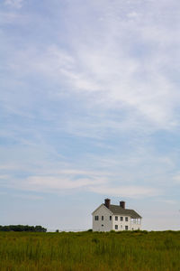 House on field against sky