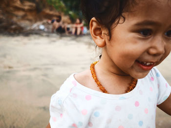 Close-up portrait of girl on beach