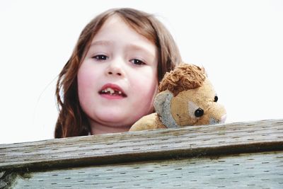 Portrait of cute girl with toy