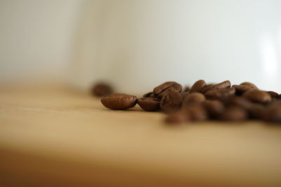 Close-up of coffee beans on table