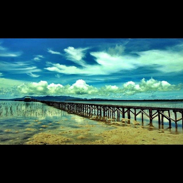 water, sky, sea, cloud - sky, scenics, tranquil scene, tranquility, cloud, cloudy, railing, pier, horizon over water, beauty in nature, nature, beach, blue, built structure, idyllic, auto post production filter, calm