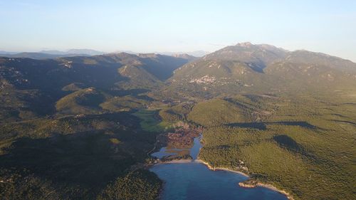 Scenic view of river amidst mountains against sky