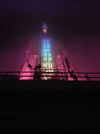 Low angle view of illuminated building at night