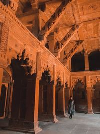 Full length of woman walking in historic building