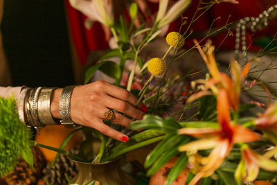 Close-up of hand holding flower bouquet