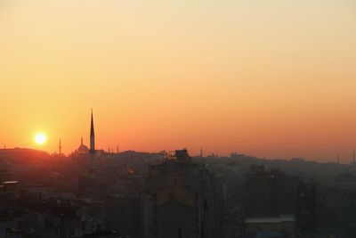 Cityscape against sky during sunset