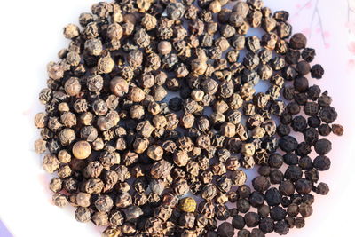 High angle view of berries on white table