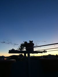 Street light against sky at dusk