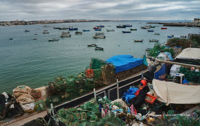 High angle view of boats moored at harbor