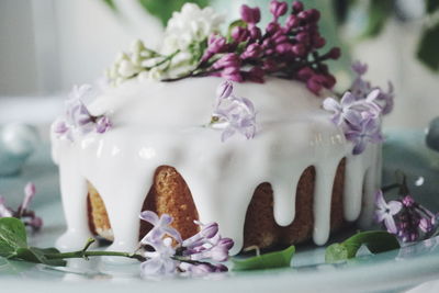 Close-up of purple flowers on cake