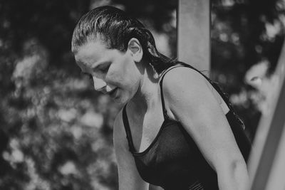 Portrait of young man looking away outdoors