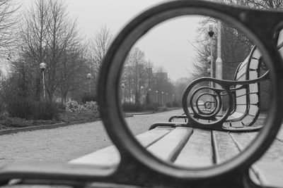 Close-up of bicycle wheel on side-view mirror