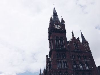 Low angle view of clock tower against sky