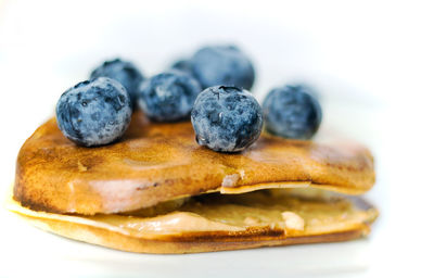 Healthy food concept displaying macro close up shot of pan cake with blueberries fruit and banana