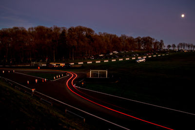 High angle view of light trails on road at night