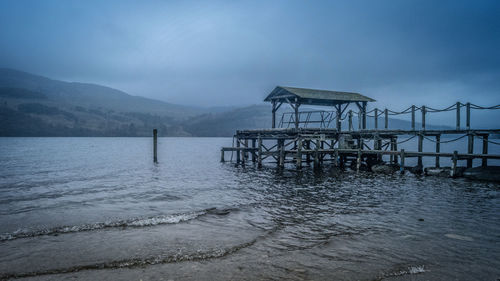 Pier on sea against sky