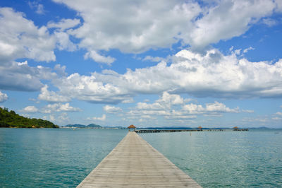 Pier over sea against sky