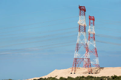 Low angle view of communications tower against sky