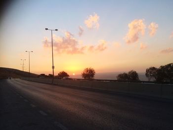Empty road at sunset