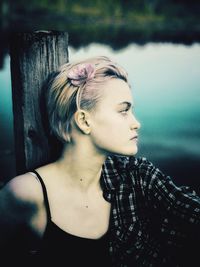 Portrait of young woman looking away