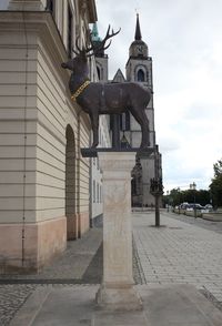 Statue of historic building in city