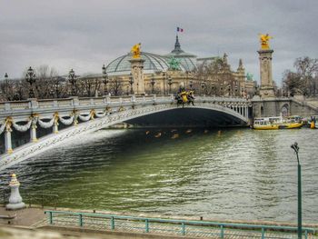 View of bridge over river in city