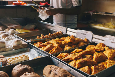 Man preparing food for sale at market