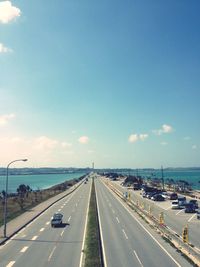 High angle view of multiple lane highway against blue sky