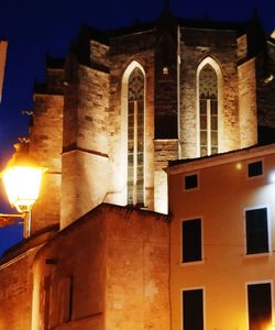 Low angle view of illuminated building at night