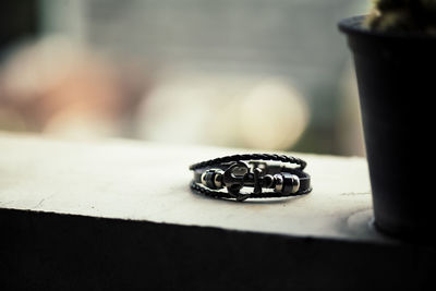 Close-up of wedding rings on table