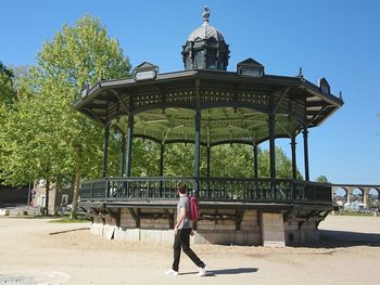 Full length of man standing against building