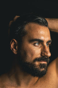 Close-up portrait of shirtless man