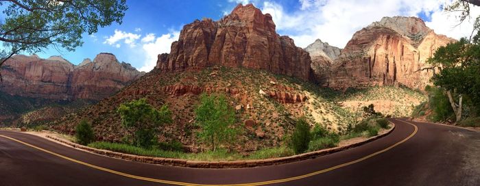 Empty road leading towards mountains