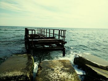 Pier on sea against sky