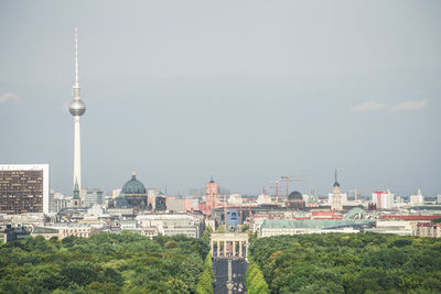 View of buildings in city against sky