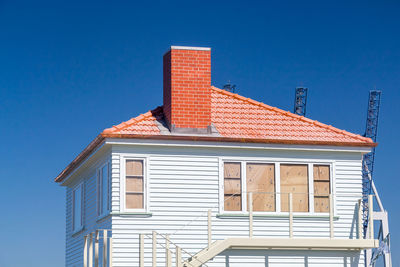 Low angle view of built structure against blue sky