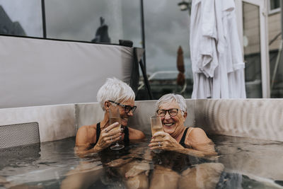 Happy female friends in spa