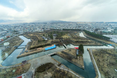 High angle view of buildings in city against sky