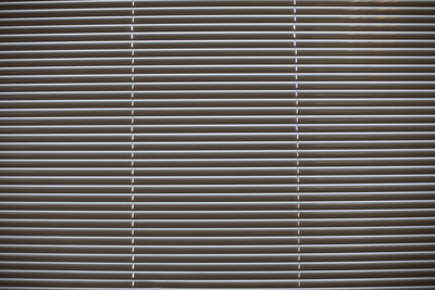 Texture of blinds. horizontal stripes. light through blinds. interior details.