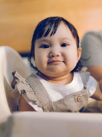 Portrait of cute baby at home