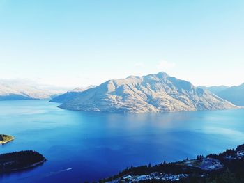 Scenic view of lake and snowcapped mountains against sky