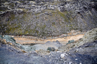 High angle view of water flowing through rocks