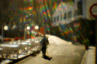 Blurred motion of people walking on road